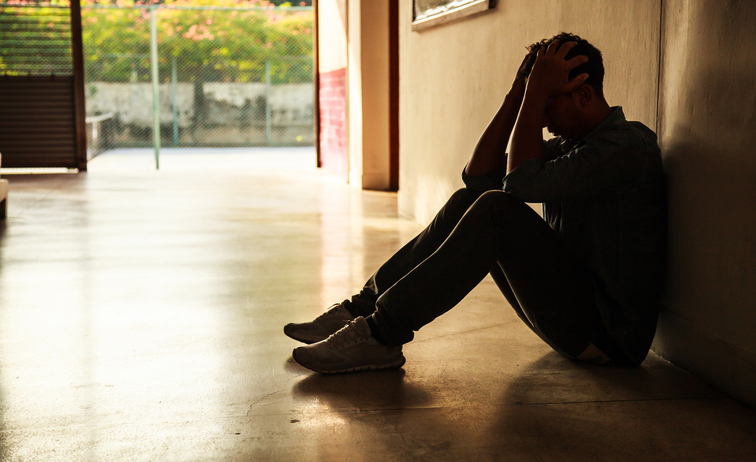 Experienced counselor reviewing coping strategies and relapse warning signs with a client, Counselor reviewing structured recovery plan with client using notes and assessment tools