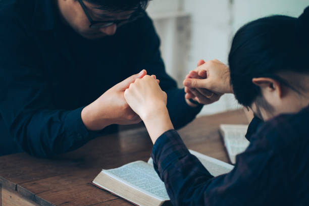 Christian counselor taking notes while guiding a client through a difficult transition