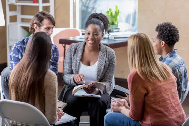 Couple meeting with counselor to discuss communication and faith-centered relationship goals